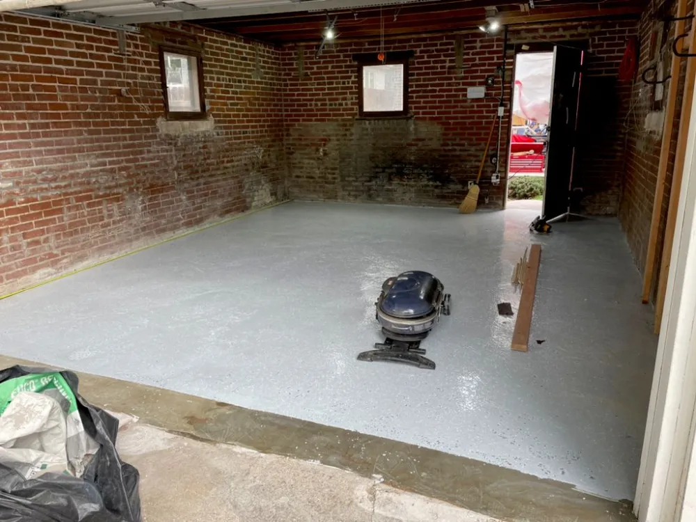 Interior concrete floor vacuumed and prepped before coating