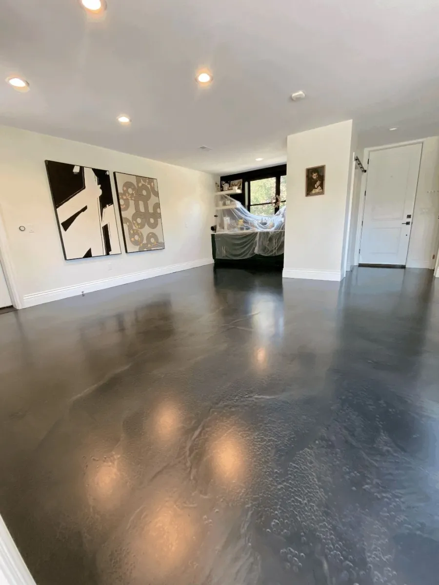 Dark stained and polished concrete floor in a finished living space